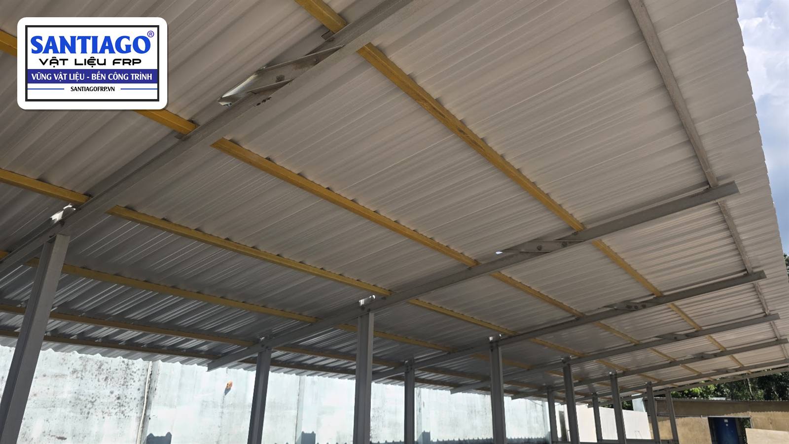 FRP composite purlins resting on the beams of a canopy frame